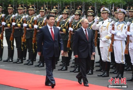   5月20日，中國國家主席習近平在上海舉行儀式歡迎俄羅斯總統普京訪華。中新社發 廖攀 攝
